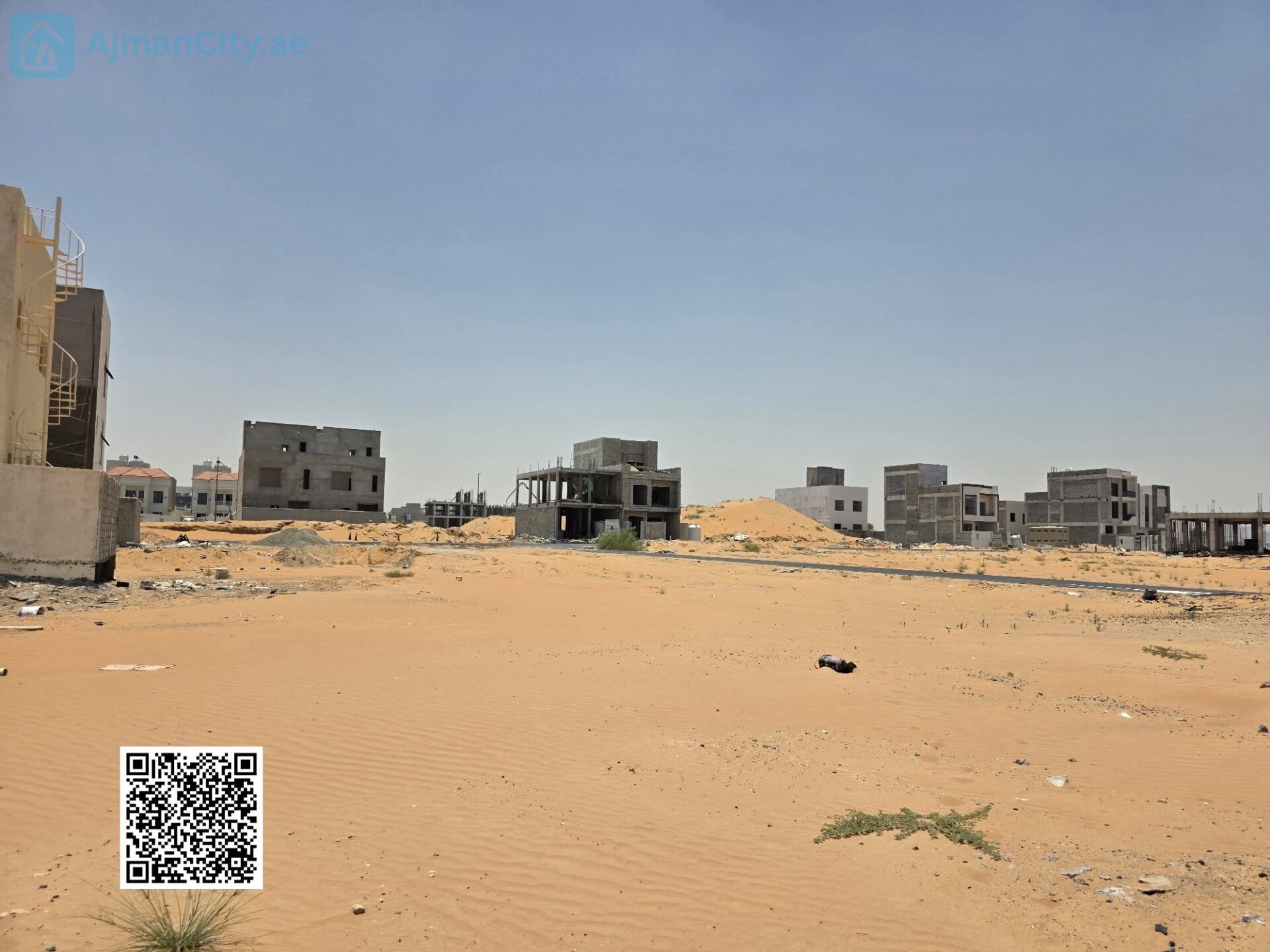 scaled_412053 أرض للبيع في الزاهية – عجمان | زاوية على شارع وسكة | موقع استراتيجي قريب من شارع الإمارات
